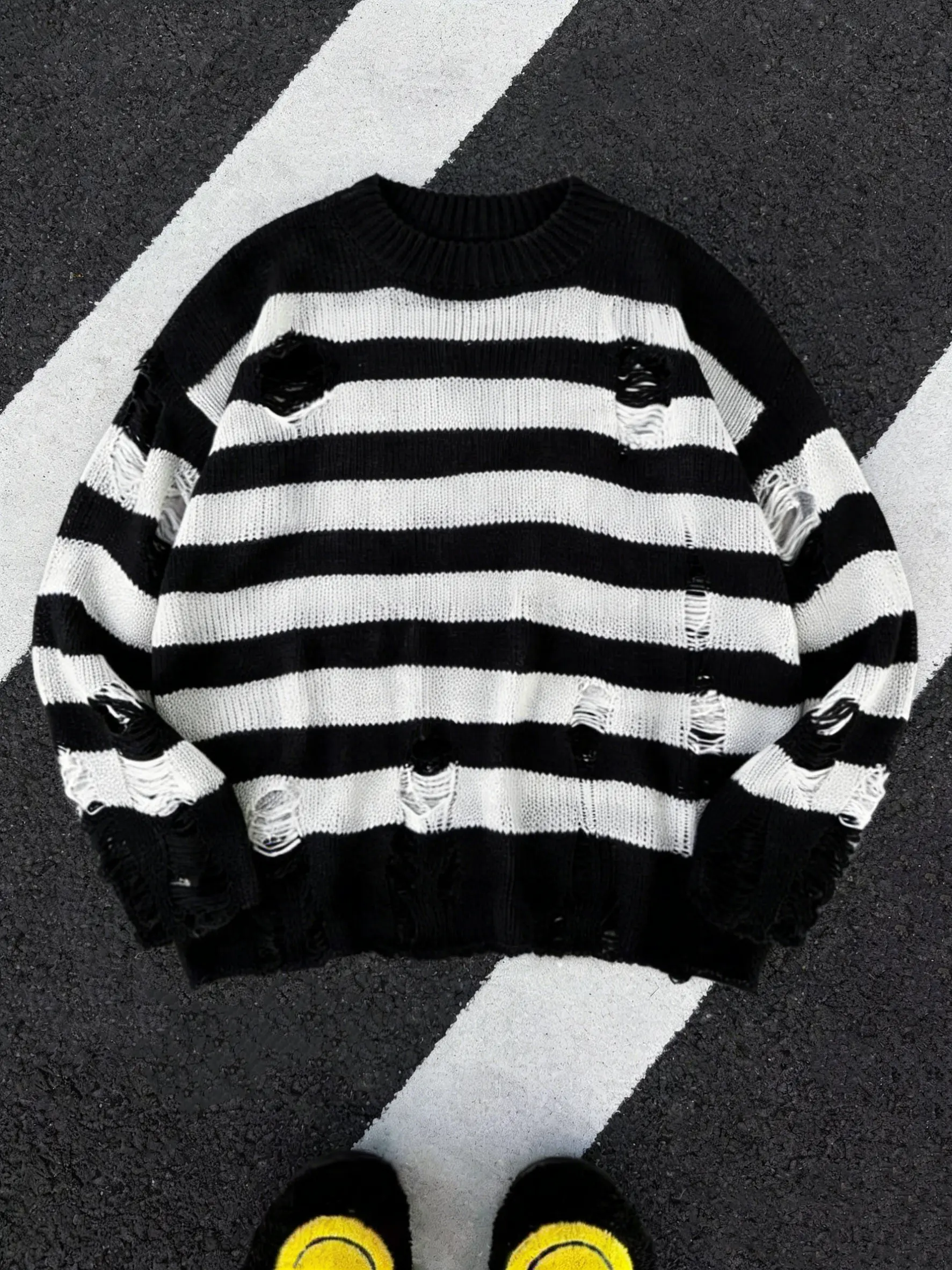 Men’s distressed striped color-block ripped sweater — a fashionable, avant-garde piece designed for punk enthusiasts. Its bold color-blocking is perfect for layering and pairs well with any pants, making it ideal for stylish streetwear.
