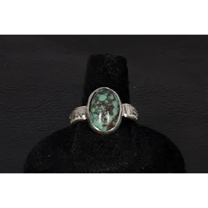 Hubei Turquoise Ring Bezel set In Sterling Silver With A Decorative Floral Ring Band