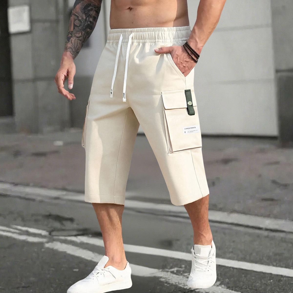 Men’s summer 2-piece cargo pants set with a drawstring waist, large pockets, and stylish letter patches—perfect for casual outings and everyday wear