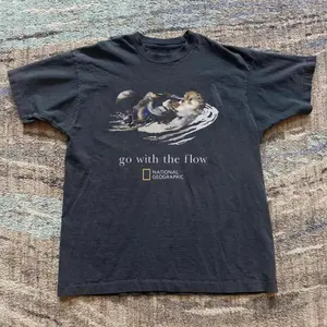 Gildan Men's and Women's T-shirt, "go with the flow" otter graphic tee, Animal tee, Y2k Unisex Graphic Tees Gothic Grunge Emo Scene Amity Affliction Style Clothes Menswear Womenswear Streetwear