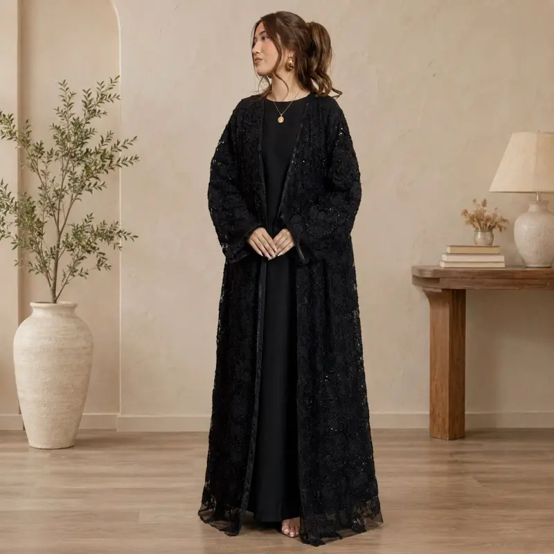 Luxury abaya featuring sheer overlay with intricate 3D floral embroidery, beadwork, and sequin embellishment