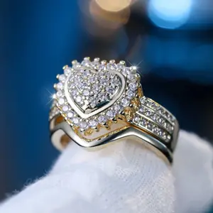 A classic 14k gold-plated ring set with heart-shaped Cubic Zirconia stones, perfect for women's everyday wear and as a gift.