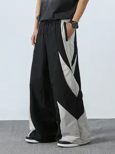 Men’s casual loose wide-leg pants with a color-block design, featuring an adjustable waistband and comfortable, skin-friendly fabric. Suitable for everyday outings, trendy styling, sports and leisure, street dance, skateboarding, and more—ideal for spring