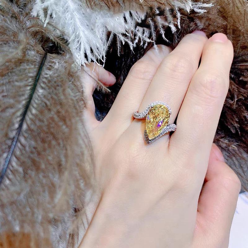 yellow A luxurious hand polished Moissanite ring paired with yellow zircon. Exquisite craftsmanship.Sparkling Moissanite and yellow zircon. Master level aesthetic design. Excellent quality. Brilliant and radiant. High quality hand polished.