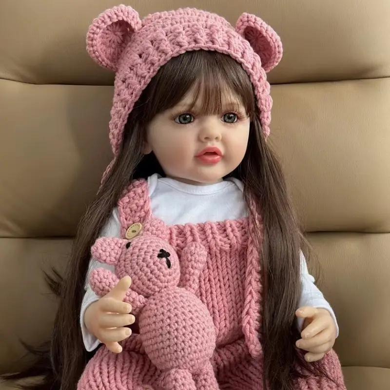 22" Realistic Princess Doll with Long Brown Hair & Pink Bodysuit - Silicone Baby Doll with Teddy Bear Stuffed Animal & Accessories - Sitting & Standing - Perfect Christmas Gift or Birthday Present for Collectors