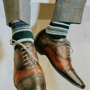 The Whelans - A Green, Black, and White Striped Sock