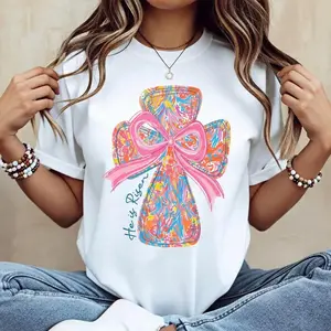 Casual Cotton Round Neck Short Sleeve Summer T Shirt Featuring Vibrant Cross and Bow Design With He Is Risen Graphic Suitable for Faith Based Events and Machine Washable