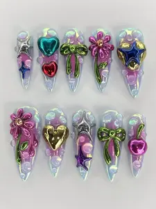 Iridescent 3D Chrome Nail Set with Metallic Hearts, Bows, Flowers and Star Charms over Jelly Bubble Base on Long Stiletto Tips in a Y2K Fantasy Style