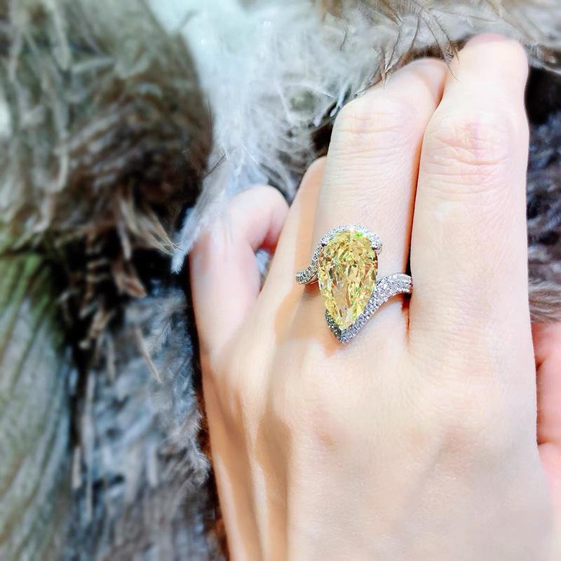 yellow A luxurious hand polished Moissanite ring paired with yellow zircon. Exquisite craftsmanship.Sparkling Moissanite and yellow zircon. Master level aesthetic design. Excellent quality. Brilliant and radiant. High quality hand polished.