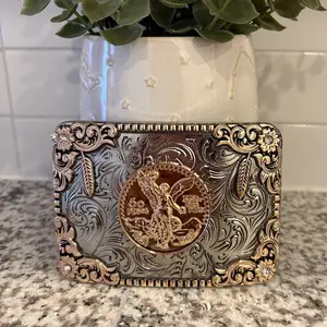 Buckles with feather an tooled accent
