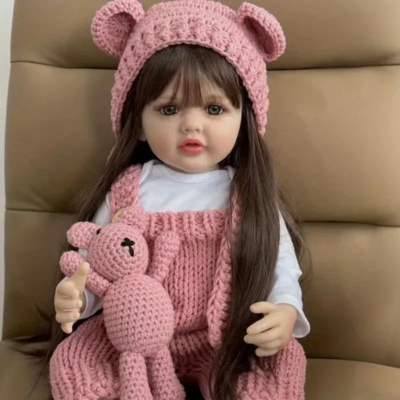 22" Realistic Princess Doll with Long Brown Hair & Pink Bodysuit - Silicone Baby Doll with Teddy Bear Stuffed Animal & Accessories - Sitting & Standing - Perfect Christmas Gift or Birthday Present for Collectors