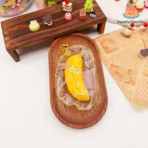 SquishyGlamToy Mr. Banana Squishy  Cute Banana Character | Funny Face Design | Clear Pouch | Taba Squishy | Soft Slow Rising