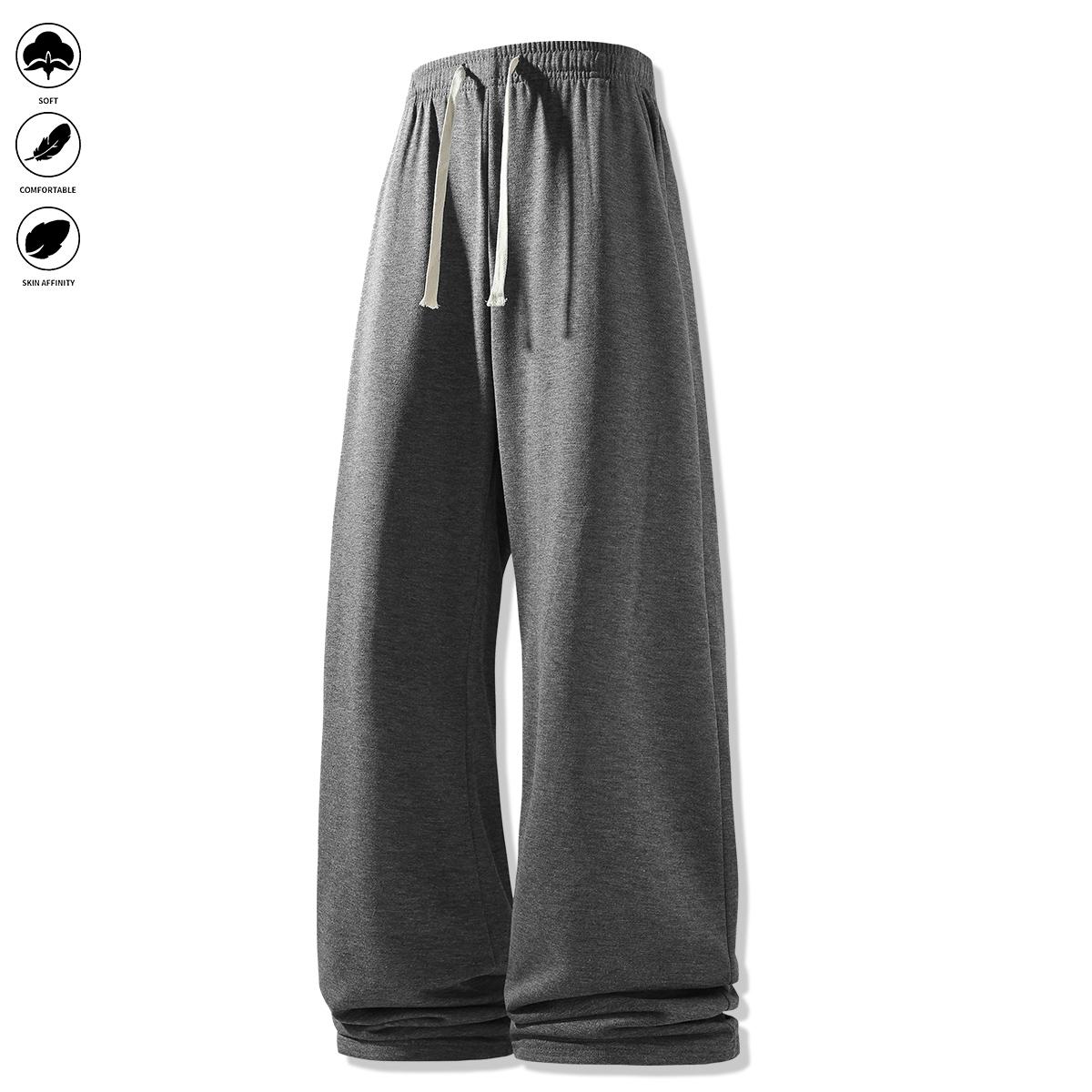 Men's loose-fit sweatpants, featuring a casual drawstring elastic waistband, wide legs, and jogger pockets. Comfortable for everyday wear and athletic bottoms.