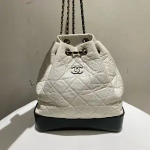 Pre-owned CHANEL leather Backpacks Small Gabrielle backpack in white aged calfskin with a contrasting black smooth calfskin base and mixed metal hardware
