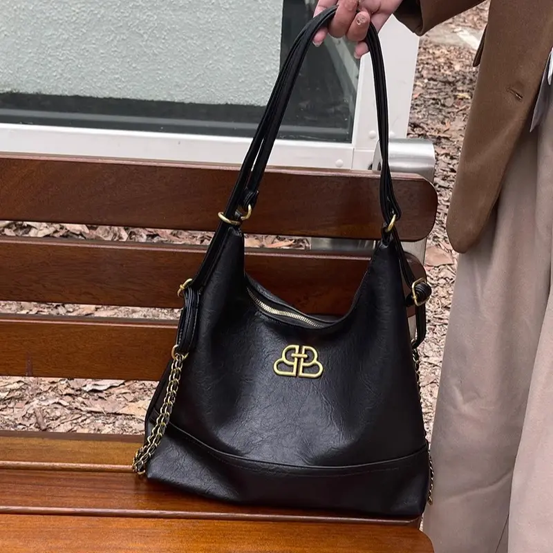 A stylish handbag featuring dual shoulder straps – perfect for everyday use – comes in various styles and boasts elegant design elements. Fashionable Unique Bags