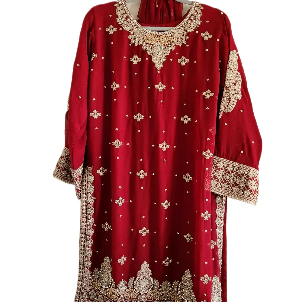 sachin and babi light blue dress This is a Pakistani chiffon embroidered suit with a soft, elegant look. The  outfit features a pastel green chiffon shirt beautifully adorned with  delicate floral embroidery and fine lace detailing on the main image 1