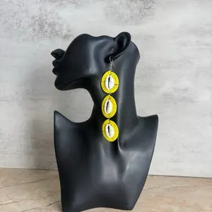 28/YELLOW: Afrocentric 100% handmade natural cowries earrings pair with Clay beads. These earrings are crafted by West African artisans to celebrate and showcase beauty and heritage .