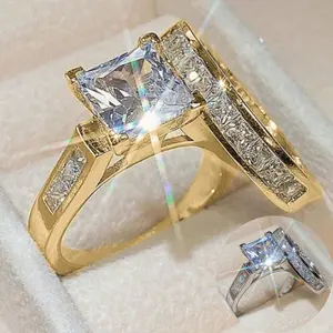 A set of two fashionable 14k gold-plated rings set with square Cubic Zirconia stones, suitable for women to wear daily, as wedding gifts, engagement gifts, or for parties.