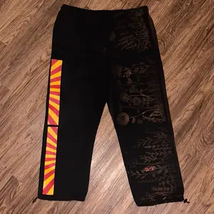 XXL- 1 of 1 GOY Bleach floral stencil pants w/ red and yellow design