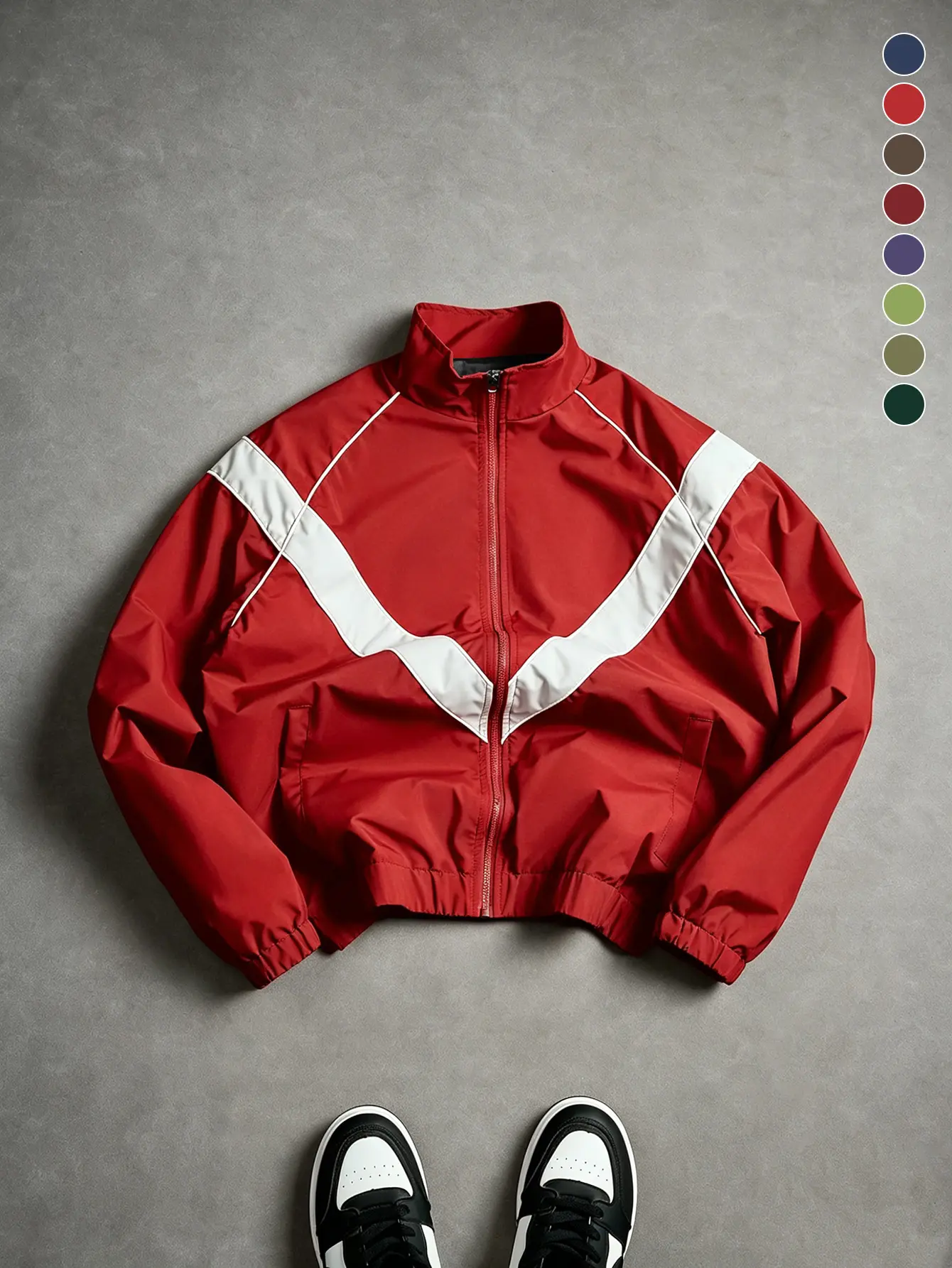 Men’s retro American sports zip-up windbreaker featuring dropped shoulders and a large V-shaped white panel detail, made from wrinkle-resistant, water-repellent fabric. Full zip closure plus hidden side pockets with sleeve openings—ideal for streetwear, c