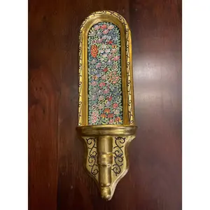 GOLD AND FLOWERED WALL SCONCE.