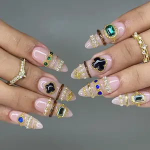 Stacked Luxe Jewelry Press-On Nails Nude Pink Base Emerald Black Onyx Gem Accents Layered Gold Rings Crystal Bands Handmade Statement Nail Set