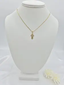 Chain with a small 14k gold plated crucifix pendant. (20)