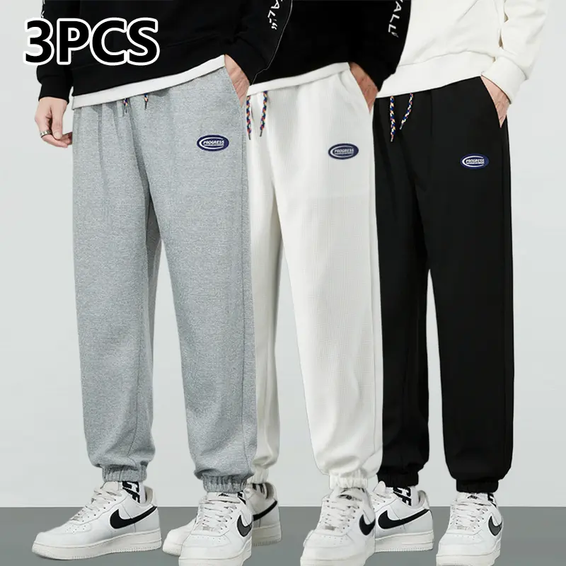 Men’s waffle-knit jogger sweatpants, all-season versatile casual athletic pants/jogging bottoms, made from polyester with a drawstring design. Suitable for everyday running and outdoor activities, featuring a plaid pattern with a fashionable, trendy look—