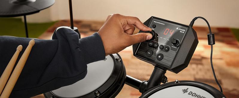 Donner DED-80 Electronic Drum Set, Electric Drum Set for Beginner with 4 Quiet Mesh Drum Pads, 2 Switch Pedal, 180+ Sounds, Throne, On-Ear Headphones, Sticks, and Melodics Lessons Included Black Donner DED-80 Electronic Drum Set, Electric Drum Set for Beginner with 4 Quiet Mesh Drum Pads, 2 Switch Pedal, 180+ Sounds, Throne, On-Ear Headphones, Sticks, and Melodics Lessons Included Black