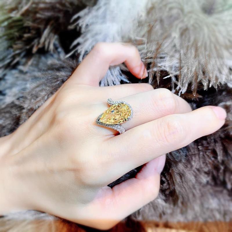 yellow A luxurious hand polished Moissanite ring paired with yellow zircon. Exquisite craftsmanship.Sparkling Moissanite and yellow zircon. Master level aesthetic design. Excellent quality. Brilliant and radiant. High quality hand polished.