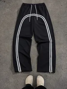 Unisex Y2K loose-fit sweatpants with a white arc stripe pattern; color-block stripes plus zippered hem detailing; heavyweight cotton feel fabric with reinforced stitching; skin-friendly material suitable for various settings to create a high-street cool l