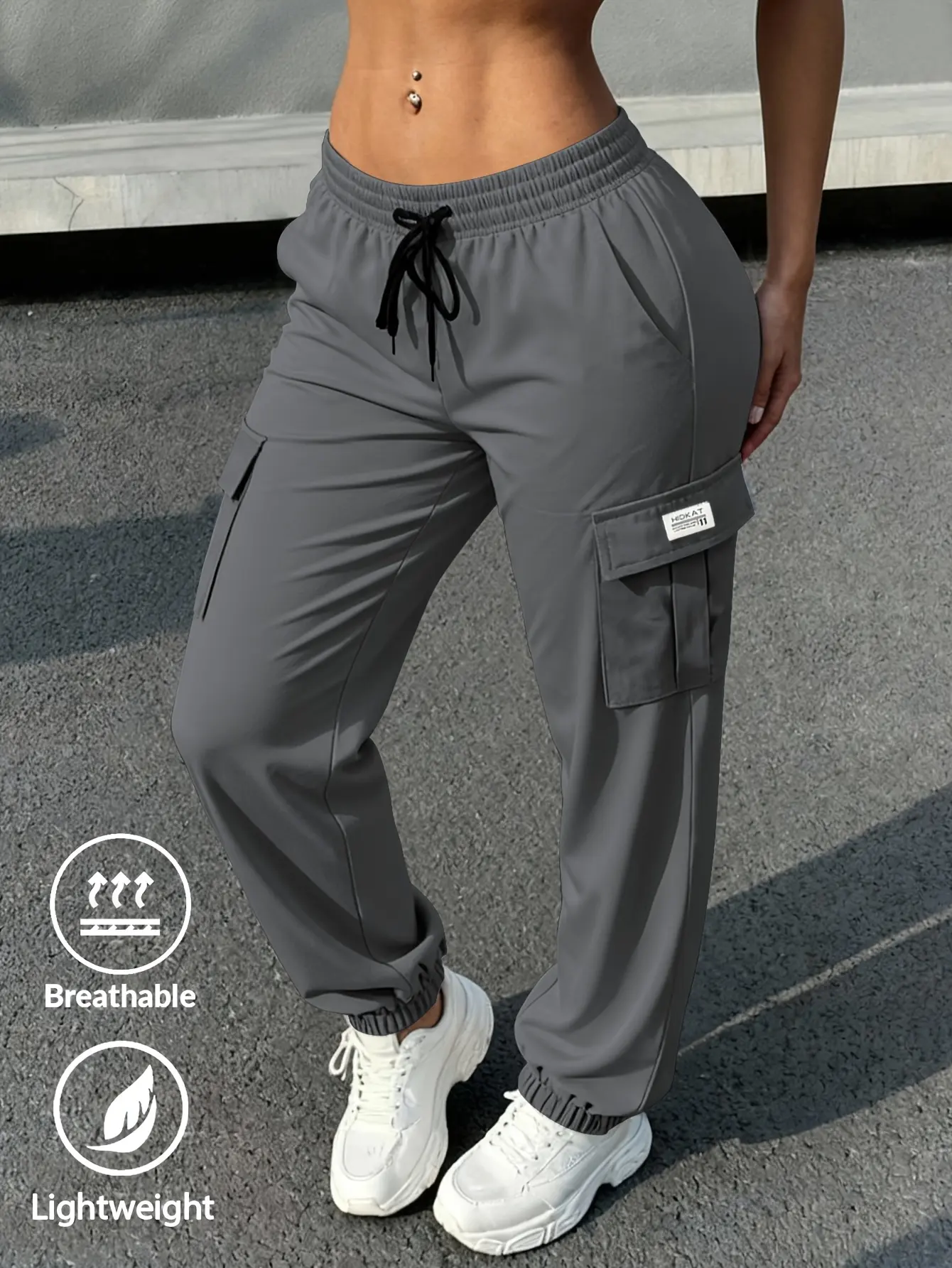 Women's fashionable,casual, and trendy solid-color lightweight and breathable tapered work pants with a drawstring waist and large pockets,perfect for sports,street style,and everyday wear.