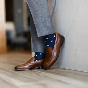 The Elliotts - A Navy Sock with White Polka Dots