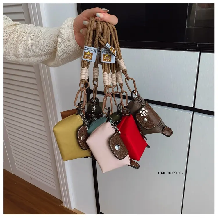 Cute cartoon pattern dual-purpose leather keychain and earbud charm, detachable lightweight bag pendant ornament—versatile all-season decor accessory perfect for decorating women’s handbags, school backpacks, car key chains, and preventing wireless earbud
