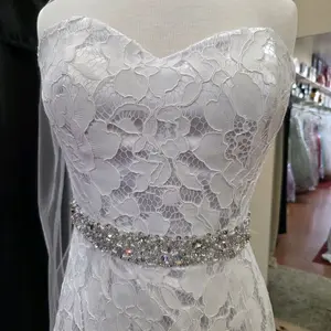 White Lace Sweetheart Wedding Dress Mermaid Gown with Crystal Embellished Waistband for Elegant Bridal Looks