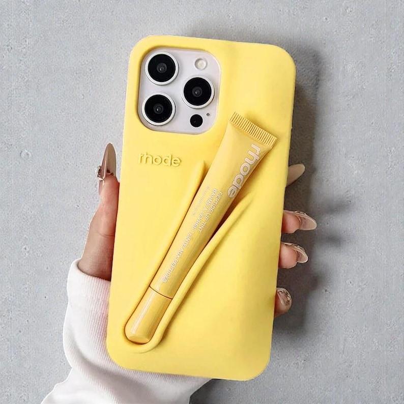 Rhode Lip Tint Silicone Phone Case with Lip Gloss Holder for iPhone 11-17 Shockproof Design Smooth Application Fashionable Protective Nutrients Convenient Daily Use
