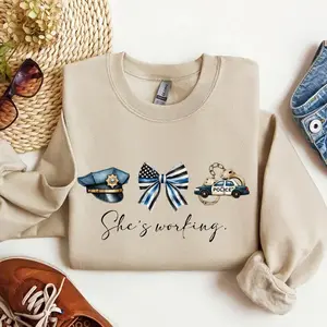 She’s Working Police Wife Sweatshirt Thin Blue Line Bow Graphic Crewneck Police Officer Wife Shirt Law Enforcement Wife Gift Police Family Support Apparel Cute Police Wife Pullover