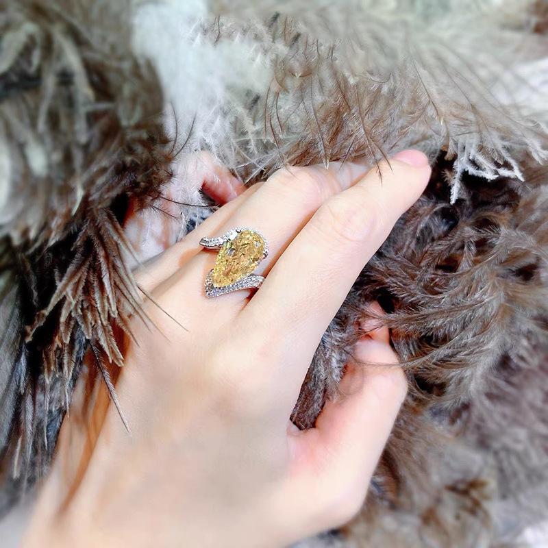 yellow A luxurious hand polished Moissanite ring paired with yellow zircon. Exquisite craftsmanship.Sparkling Moissanite and yellow zircon. Master level aesthetic design. Excellent quality. Brilliant and radiant. High quality hand polished.