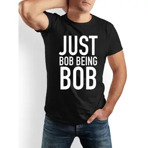 JUST BOB BEING BOB Funny Saying T-Shirt - Bold "JUST BOB BEING BOB" Graphic Tee - Crew Neck Short Sleeve Shirt for Men & Women - Everyday Casual Wear & Funny Gift Idea - Machine Washable - Black/White Available, Humorous Apparel, Playful Design, Durable P