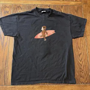 Curious Georgee Surfing Graphic T-Shirt – Black Cotton Tee, Cute Cartoon Monkey Shirt, Unisex Casual Streetwear Top, unisex shirt, gift for her for him