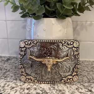 Buckles with feather an tooled accent