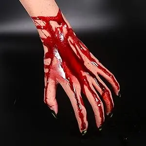 Dripping fake blood on the back of a hand
